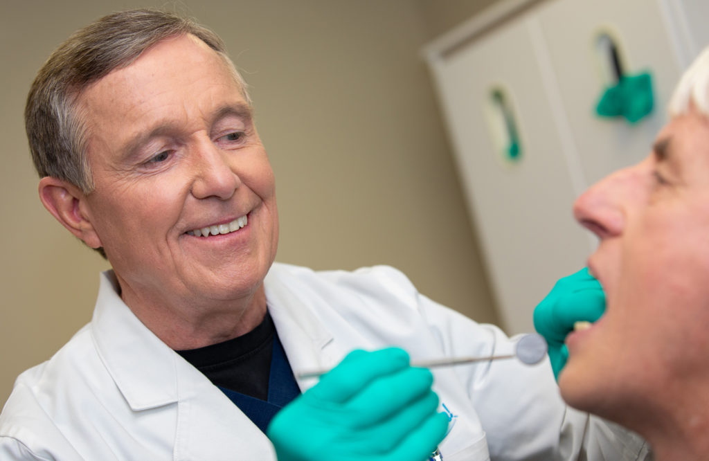 Dr. Lane working with patient - Lane Oral Surgery - Plymouth, MA and Sandwich, MA