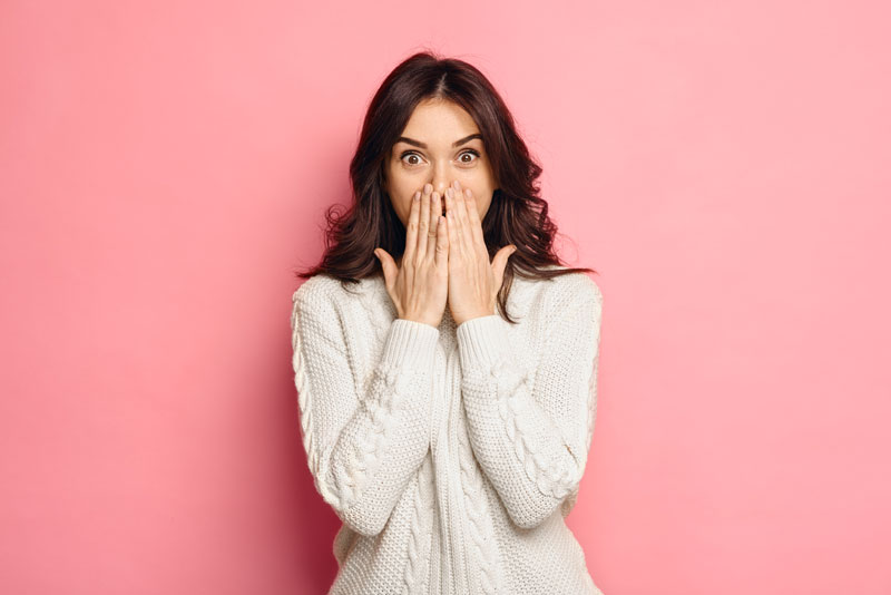 Dental Patient Shyly Hiding Her Missing Tooth With Her Hands