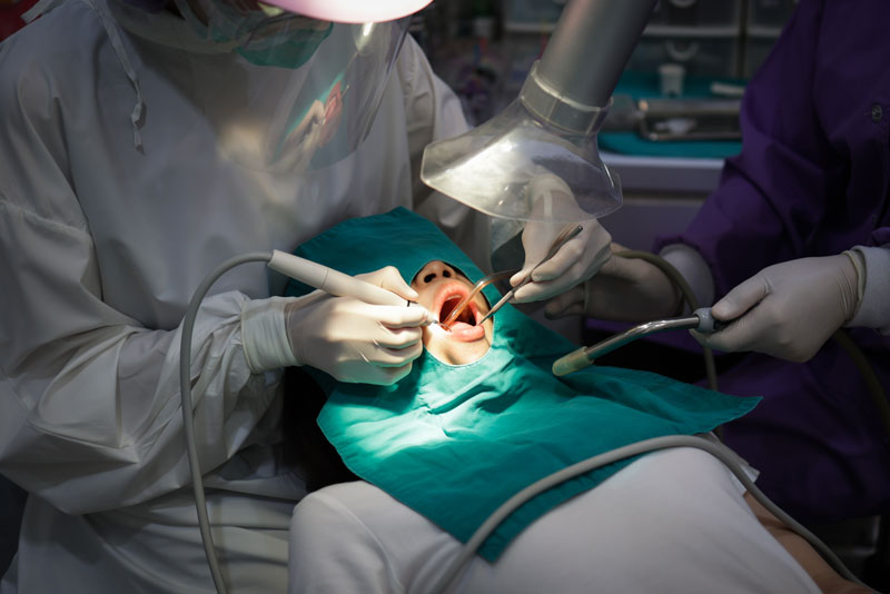 Dental Patient Undergoing An Oral Surgery Procedure
