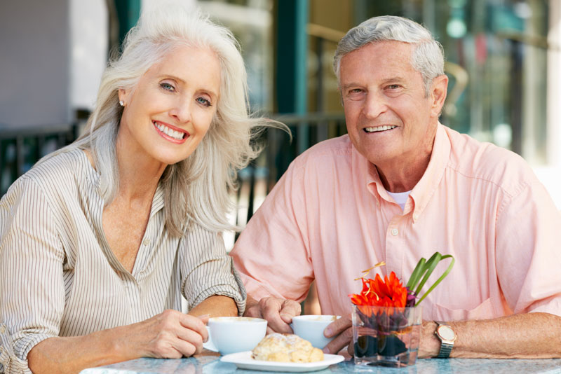 Dental Implant Patients Eating Together With Their False Teeth in Plymouth, MA