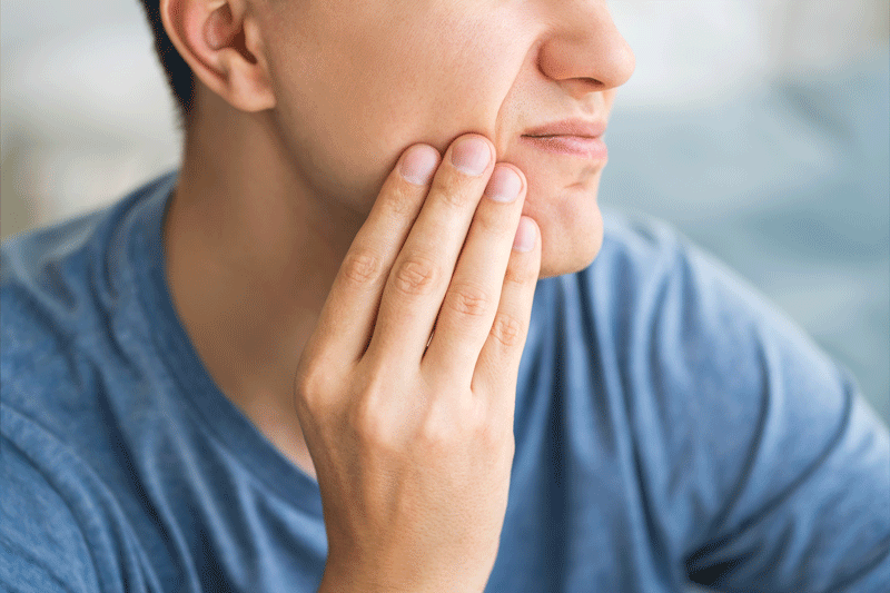 A man with toothache, periodontal disease in wisdom teeth