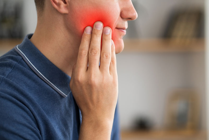 A man with toothache, periodontal disease in wisdom teeth