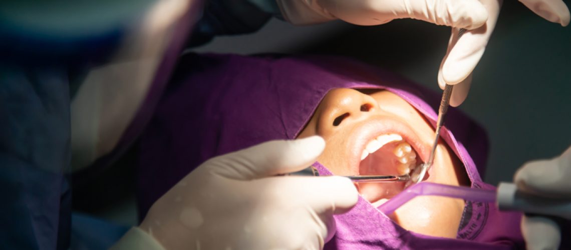 Tooth removal . Dental, dentists, dental laboratories in low light conditions. Oral health and teeth.