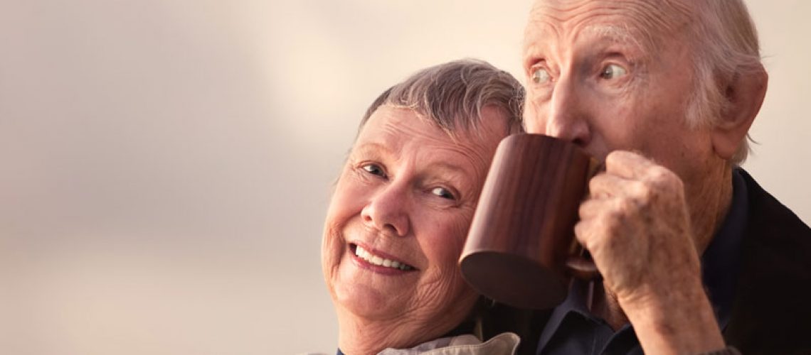 Dental Implant Patients Smiling While Drinking Coffee