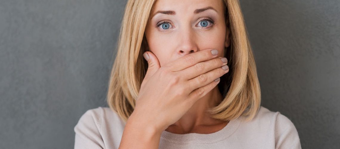 Dental Patient Covering Mouth