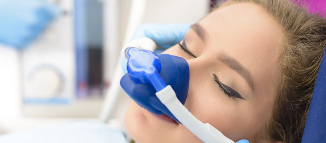 a dental implant patient during an inhaled sedation procedure