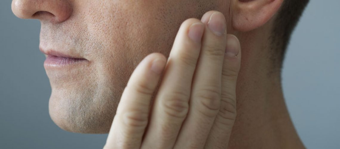 Dental Patient Suffering From Jaw Pain