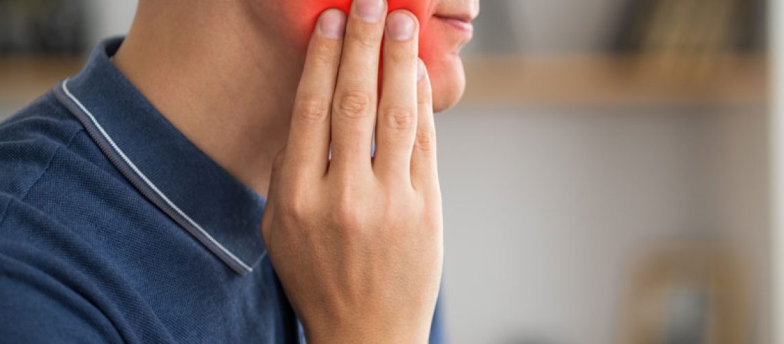 A man with toothache, periodontal disease in wisdom teeth